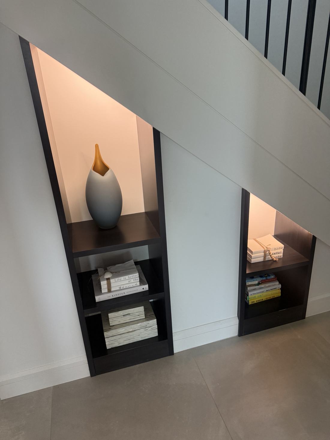 CES project — under-stair display niches with concealed accent lighting