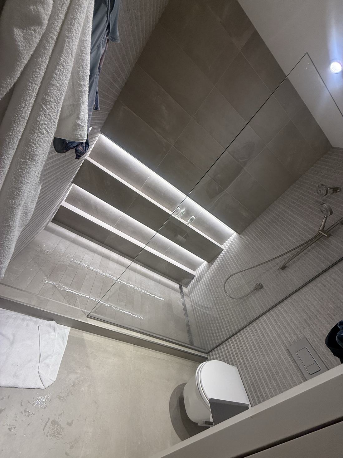 CES project — linear LED shelf lighting in a modern shower