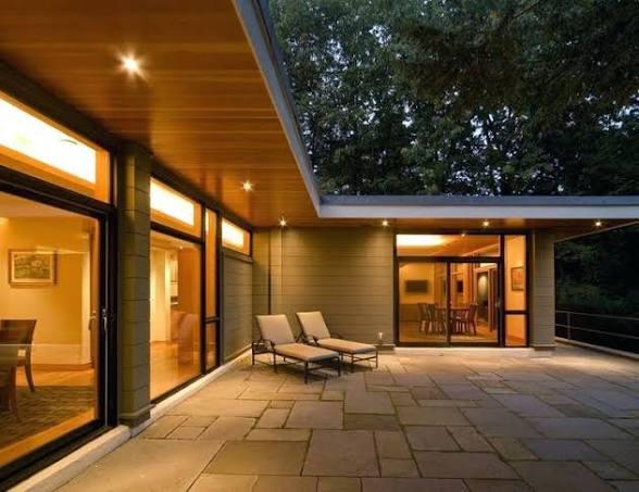 Warm-white architectural soffit lighting on a luxury home